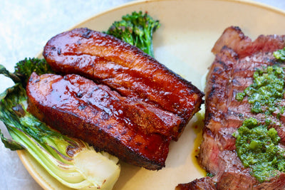 Gourmet BBQ dish featuring ribs and steak, served at KNEAD Supper Club