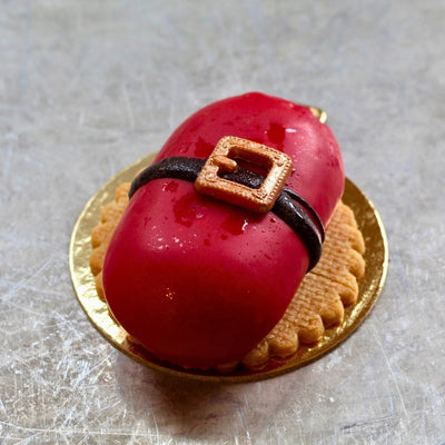 Cherry Chocolate Santa with sour cherry mousse, chocolate insert, dipped in red chocolate with gold belt buckle