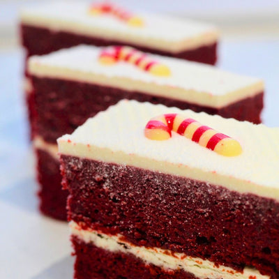 Seasonal Christmas cake slice with red velvet sponge and cream cheese frosting