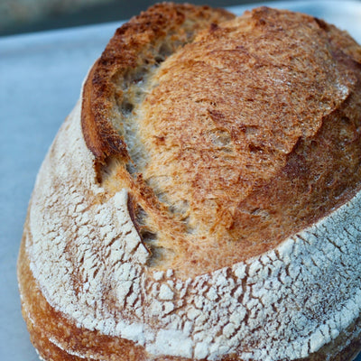 Freshly baked artisan sourdough bread with golden crust